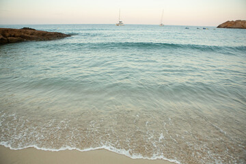 Fototapeta na wymiar Beautiful beach with very clean and azure water on the mediterranean sea in the island of Ibiza, Spain