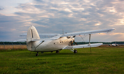 Fototapeta na wymiar An old vintage biplane parked at the airfield