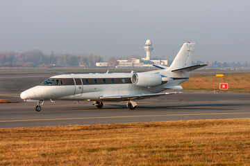 Business jet taxiing on tarmac