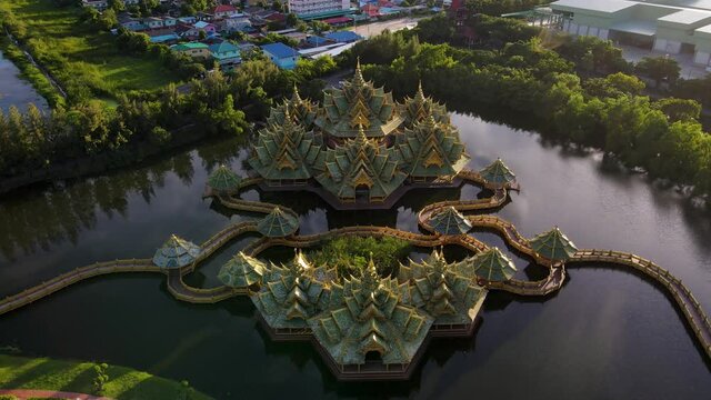 Epic Fly in of a breath taking Temple on a lake at dawn Ancient City Siam, Bangkok, Thailand