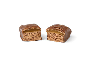 Chocolate sweet with nougat and caramel isolated on white background.