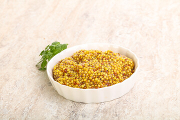 Grain mustard sauce in the bowl