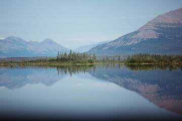Fototapeta na wymiar The landscape of the mountain lake with reflection