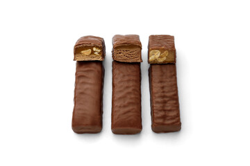 Three types of chocolate sweets with nougat, caramel and nuts.