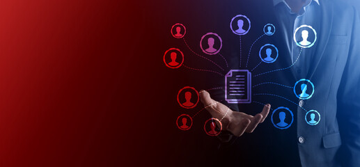 Man hold document and user icon.Corporate data management system DMS and document management system concept. Businessman click or publish on document connected with corporate users