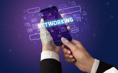 Hand using smartphone with social media concept