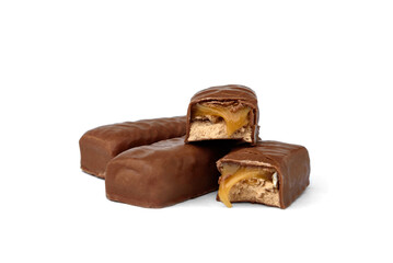 Broken chocolate bar with nougat and caramel isolated on white background.