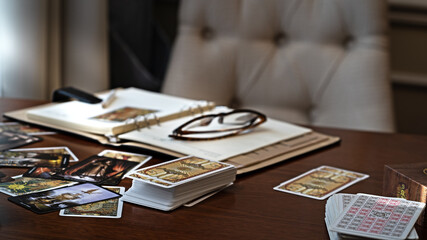 Tarot card reader arranges cards in a card spread. Fortune-telling concept