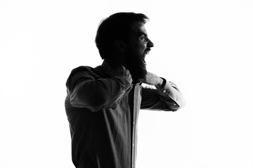 Man Secret agent with a gun in the hands of a crime posing studio