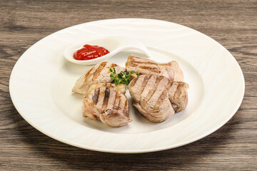 Grilled pork tenderlion with tomato sauce