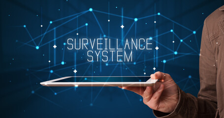 Fototapeta premium Person holding tablet, security concept