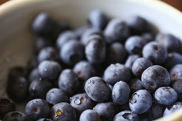 blueberries in a plate on the table background