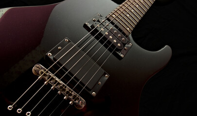 Fototapeta na wymiar Electric guitar on a black background.