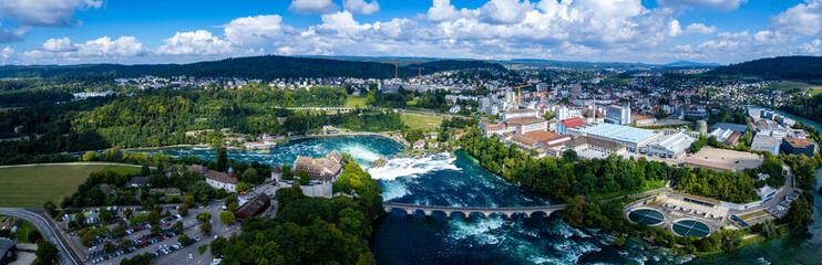 Fototapeta na wymiar Aerial view of the waterfall beside Schaffhausen in Switzerland on a sunny day in summer.