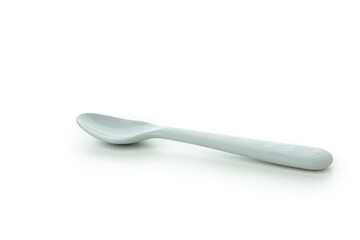 Single plastic spoon isolated on white background