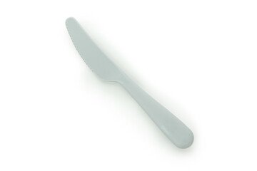 Single plastic knife isolated on white background