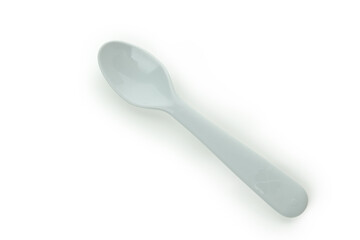 Single plastic spoon isolated on white background