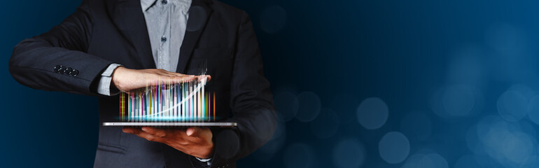 Businessman using tablet with trading graph. stock exchange marketing analyzing chart. information statistics diagram profit. investment and marketing concept.