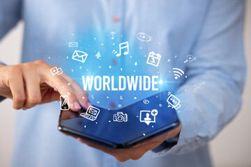 Businessman holding a foldable smartphone, social media concept