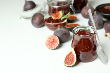 Concept of tasty food with fig jam on white background