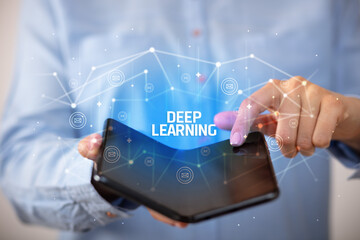 Businessman holding a foldable smartphone, new technology concept