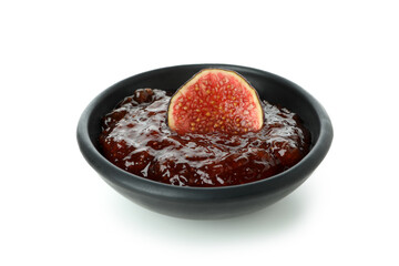 Bowl with fig jam and slice isolated on white background