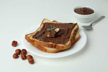 Concept of delicious food with chocolate paste on white background