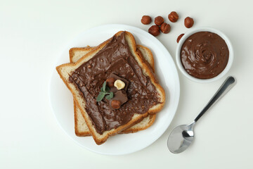 Concept of delicious food with chocolate paste on white background