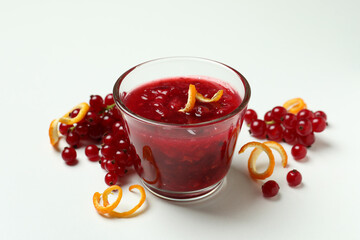 Cranberry sauce and ingredients on white background