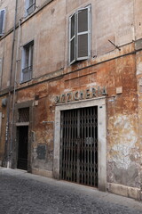 Fototapeta na wymiar Rome Street View with Aged Building Facades in the Jewish Ghetto, Italy