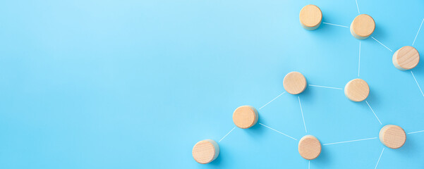 Networking, social media, internet communication concept with Wooden cubes on blue background, copy space