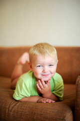 Fototapeta premium a pretty little boy is sitting