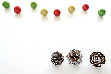 Christmas pinecones on white background.