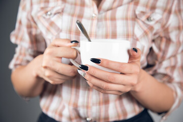 woman holding cup of coffee