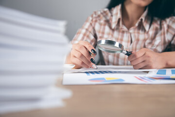 woman hand magnifier with graph