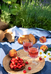 Set for picnic on blanket in lavender field