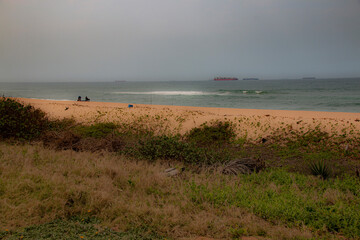 View of Ships at Sea with Vegetation Covered Sand Dunes