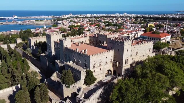 Cinematic drone shot circling around a castle in greek island.