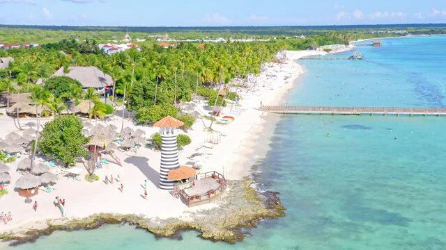 Aerial View Of Tropical Island Beach With Lighthouse And Boardwalk. Playa Dominicus In Dominican Republic.