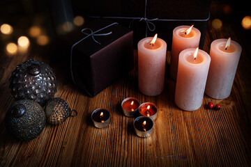 Christmas decoration on old wood
Christmas gifts decorated with candles and atmospheric bokeh on...