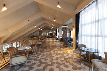 Interior of a spacious cafe bar in hotel lobby