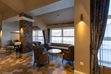 Interior of a spacious cafe bar in hotel lobby
