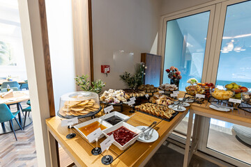 Breakfast on a buffet table in the restaurant