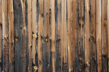 A wooden background within wooden boards colored