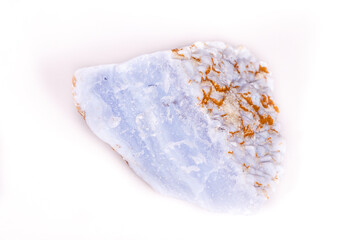 Macro mineral blue agate in the rock on white background