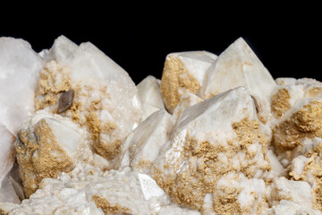Macro mineral stone Snow quartz with calcite on a black background