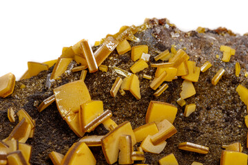Macro mineral stone yellow Wulfenite on a white background