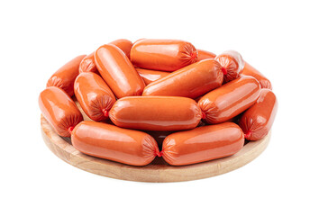 Raw sausages are stacked on a cutting board. Side view, close-up.