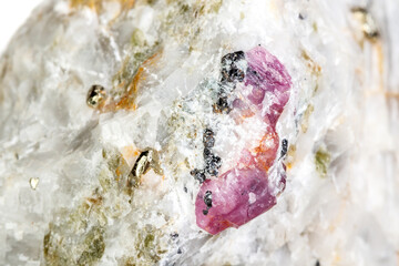 Macro mineral stone Ruby in rock on white background