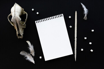 White notebook mockup template on black background with magical mysterious mood.